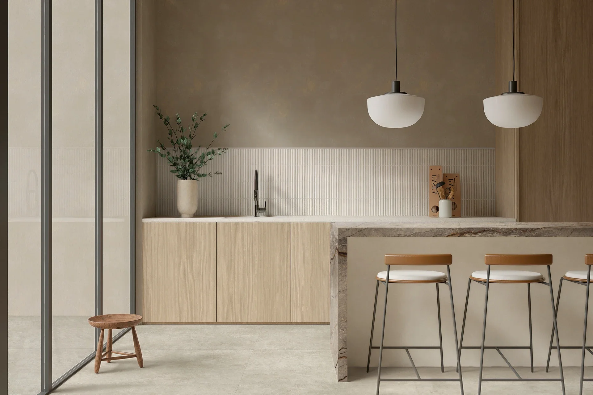 Contemporary minimalist kitchen featuring the Marazzi Room Collection, with porcelain flooring, vertically stacked 3D backsplash tiles, and a dramatic stone-look island, available through PietraCasa.
