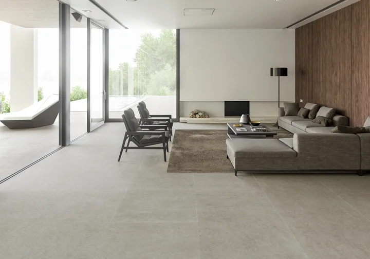 An expansive living space featuring seamless indoor-outdoor flooring with the Bera&Beren collection by Living Ceramics, available through PietraCasa.