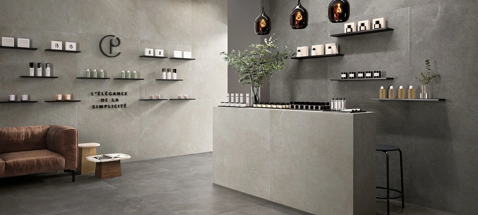 Retail interior space featuring the Supergres Epika porcelain tile collection, inspired by elegant French limestone, with concrete-effect and natural stone-look designs in soft neutral tones, supplied by PietraCasa.