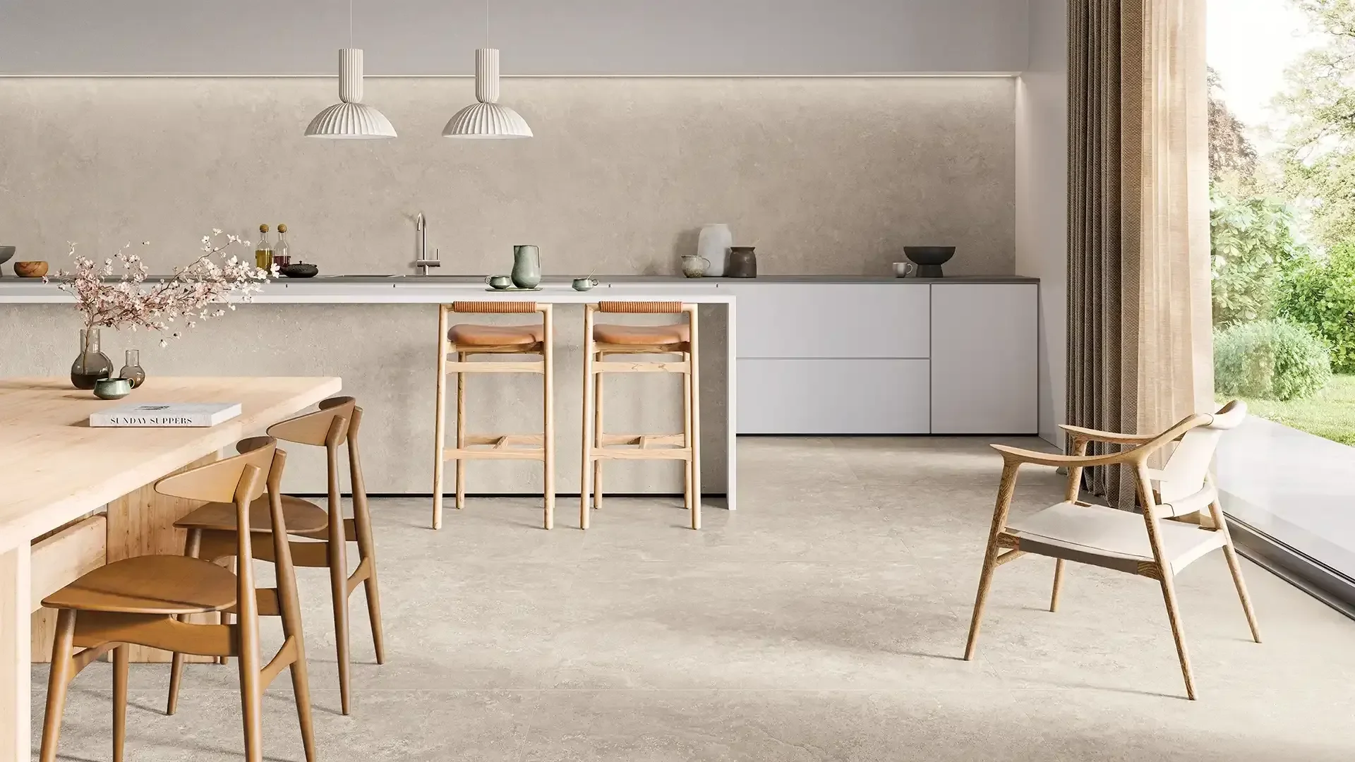 Modern kitchen featuring high-end porcelain flooring and matching wall slabs from the Trevi Collection by the Italian brand Ceramiche Keope, available through PietraCasa.