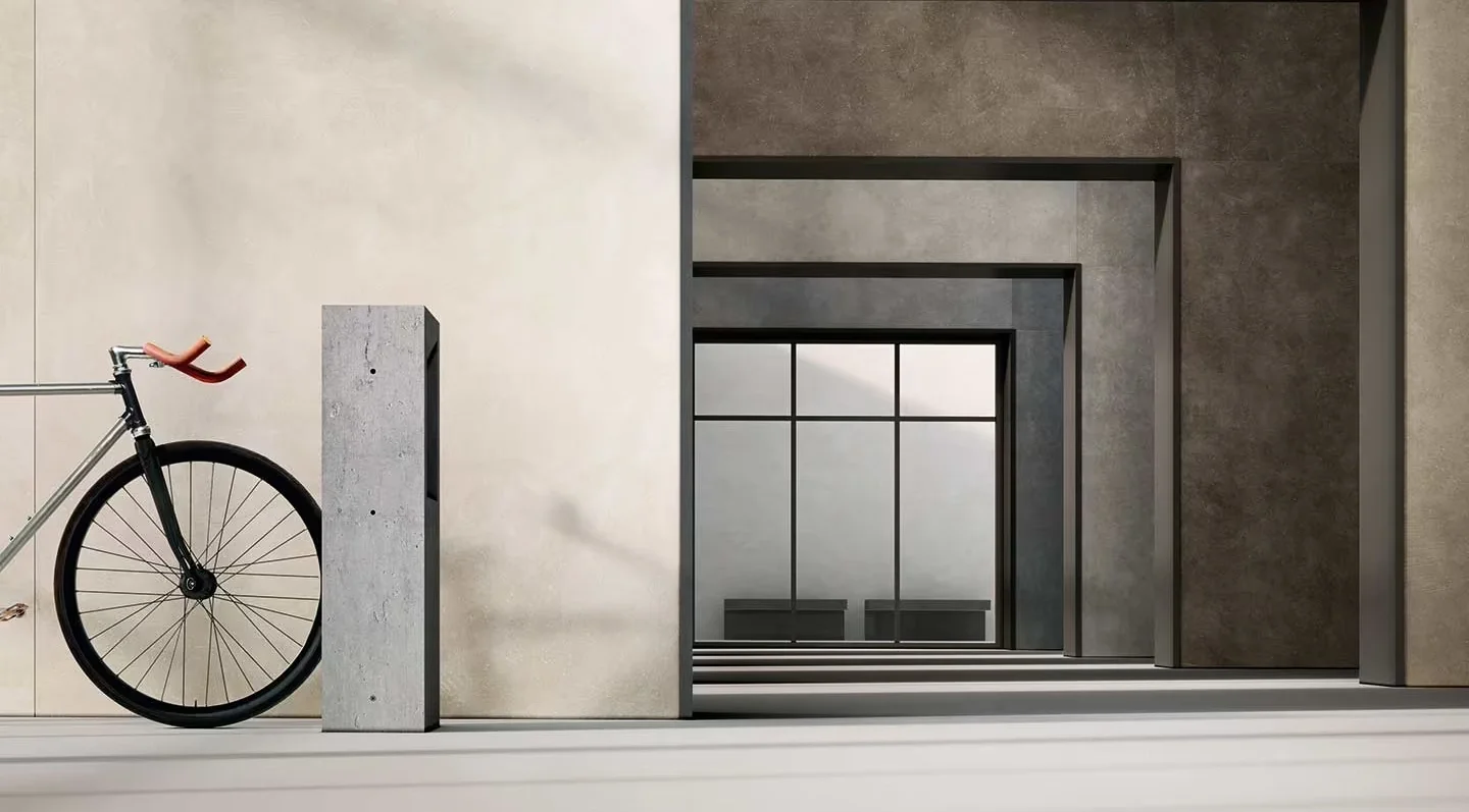 Modern architectural space featuring large porcelain stoneware slabs from Florim with a sophisticated concrete or stone effect, expertly supplied and installed by PietraCasa.