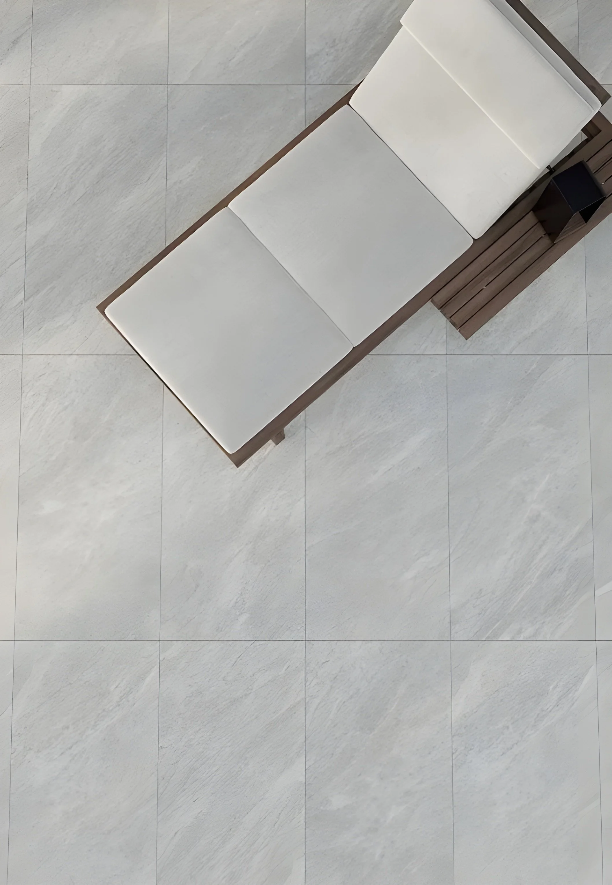 Outdoor patio area featuring Ceramiche Keope's Versilia marble-effect porcelain tiles in Bardiglio Silver, celebrated for their soft grey veining, available through PietraCasa