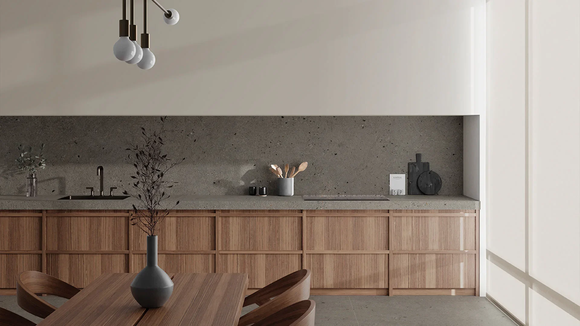 Sophisticated kitchen design featuring Inalco TOTEM iTOP Gris Abujardado, a bush-hammered, stone-like material dotted with grey pebbles, exclusively distributed in the UK by PietraCasa.