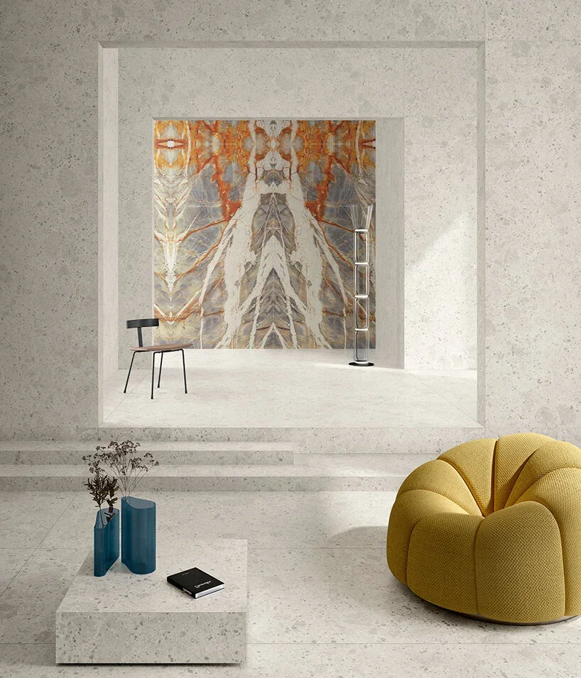 Seamless minimalist interior featuring Ariostea Ultra Fragmenta Bianco Greco porcelain stoneware slabs for walls and flooring, supplied and installed nationwide by PietraCasa.