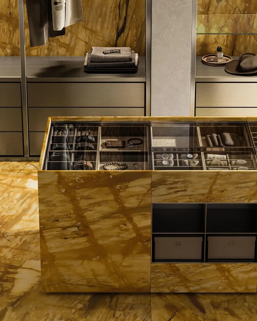 Luxurious wardrobe island featuring Margraf's Giallo Siena natural marble, a prestigious Italian stone with a golden-yellow background and rich veining, supplied by PietraCasa.