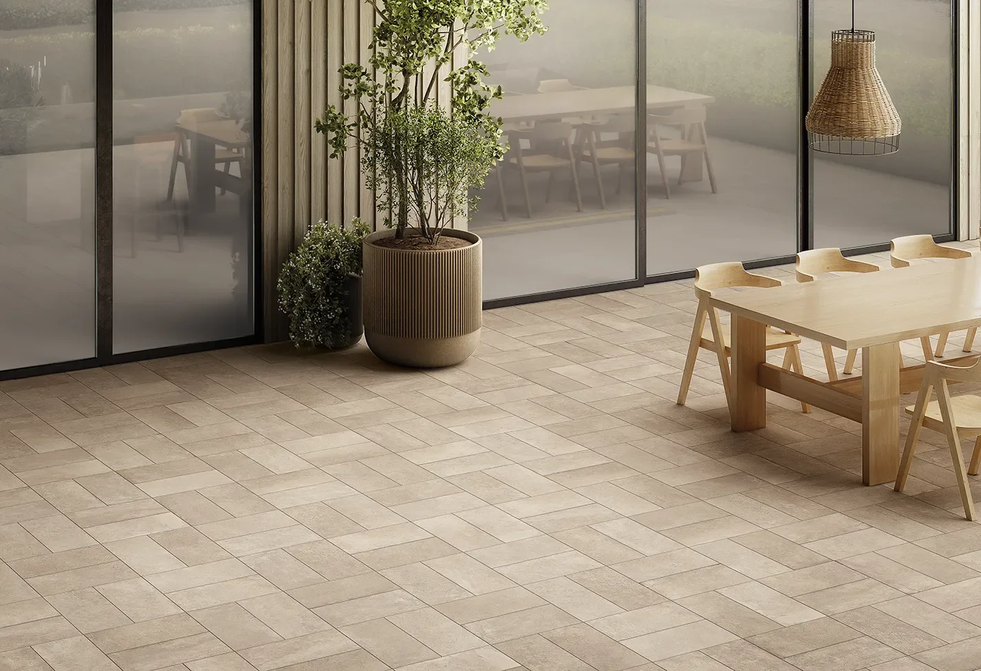 Outdoor patio area featuring the Ceramiche Keope Street collection in Londra Beige, a high-performance concrete-effect porcelain stoneware tile, available through PietraCasa.