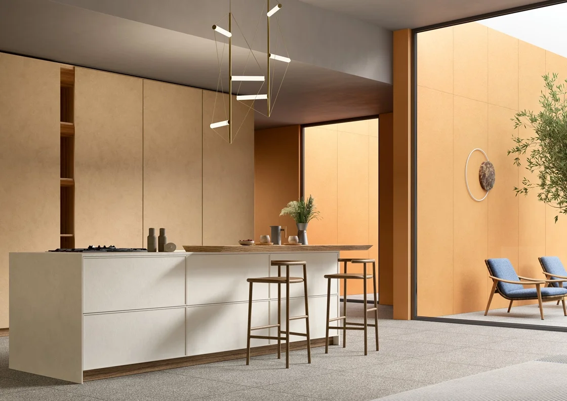 A modern interior showcasing the award-winning Pigmenti collection by Lea Ceramiche, a highly tactile, solid-color ultra-thin ceramic series designed by Ferruccio Laviani, available through PietraCasa.