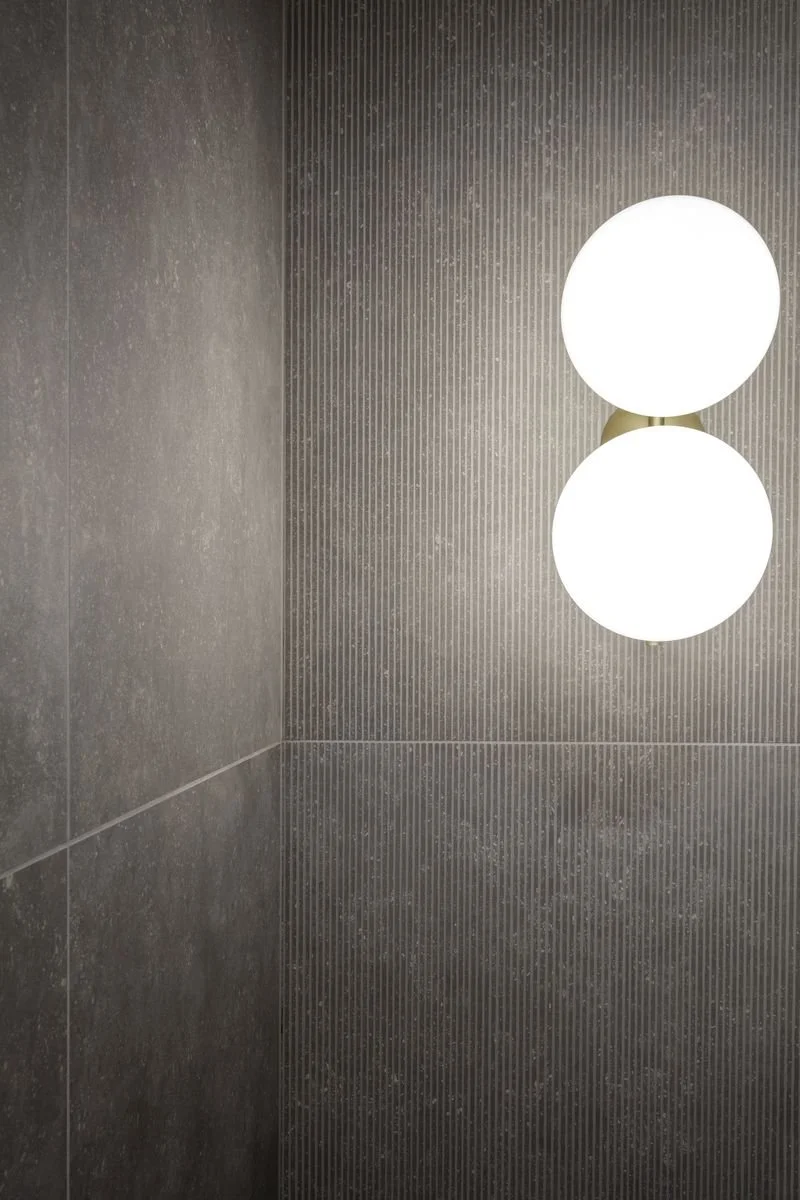 Modern interior wall featuring the Flos IC Lights C/W1 Double wall lamps, designed by Michael Anastassiades, available through PietraCasa.