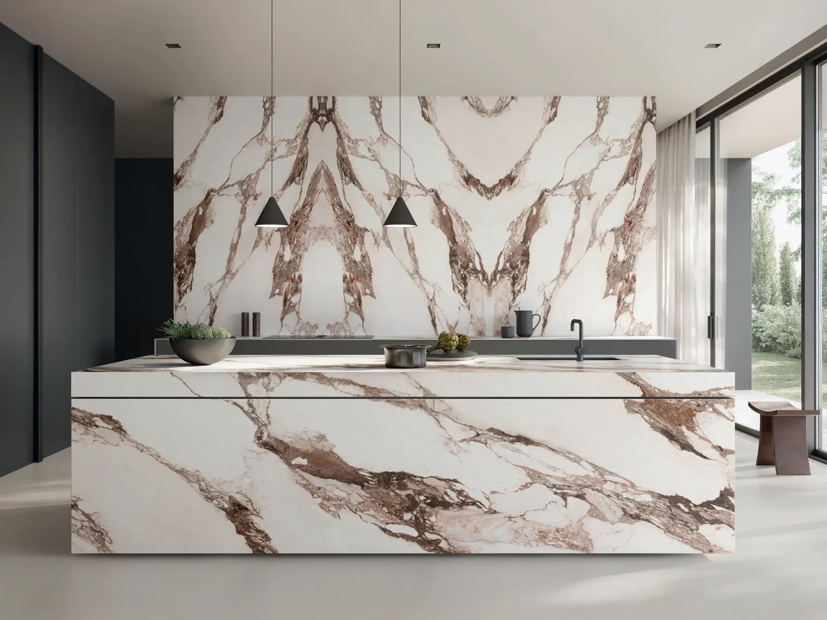 Modern kitchen interior featuring Italstone's Calacatta Vagli antibacterial porcelain stoneware slabs on the island and backsplash, available through PietraCasa.