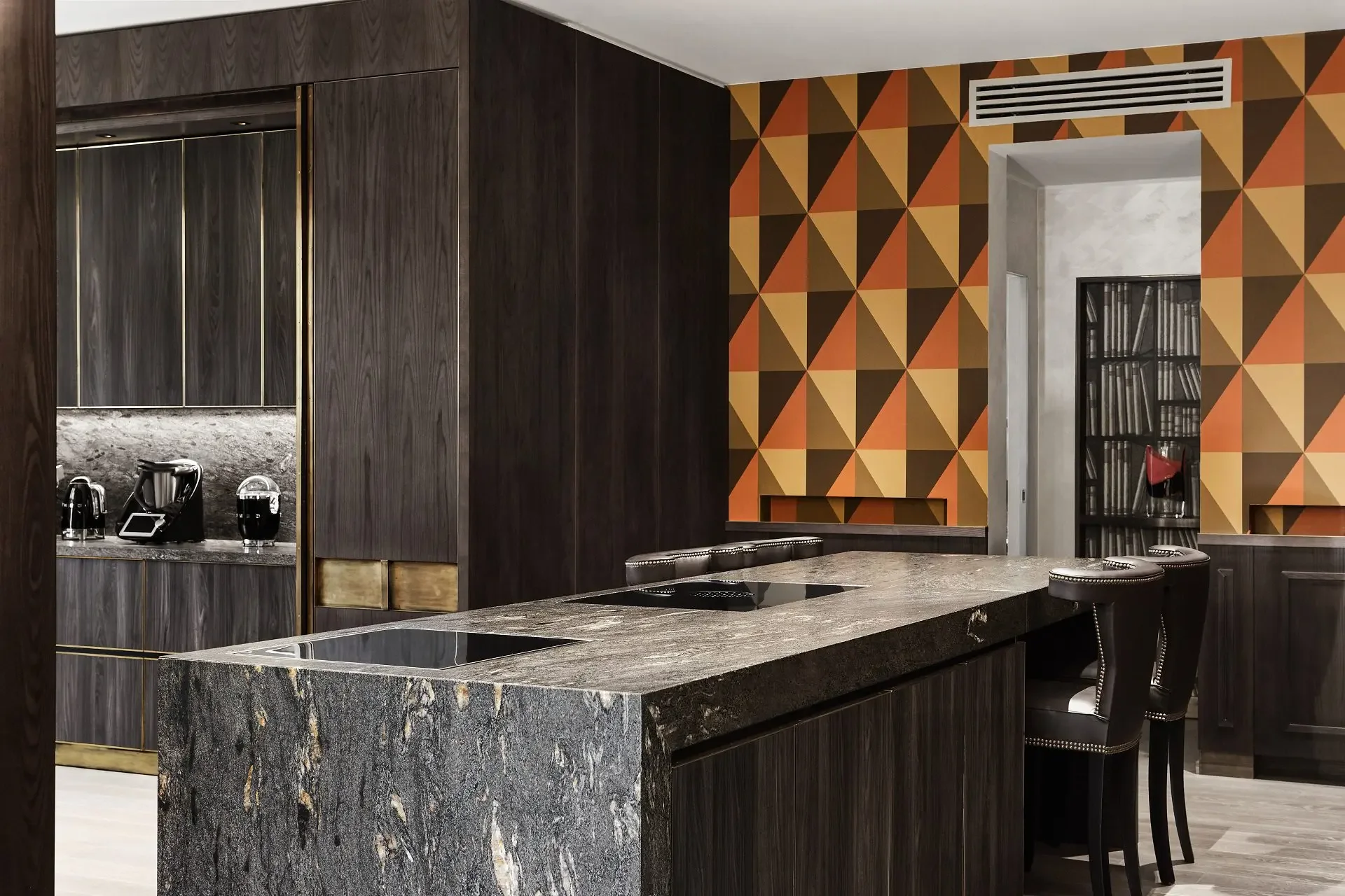 Stunning kitchen countertop and monolith island featuring Cosmic Black granite by Antolini, supplied by PietraCasa.