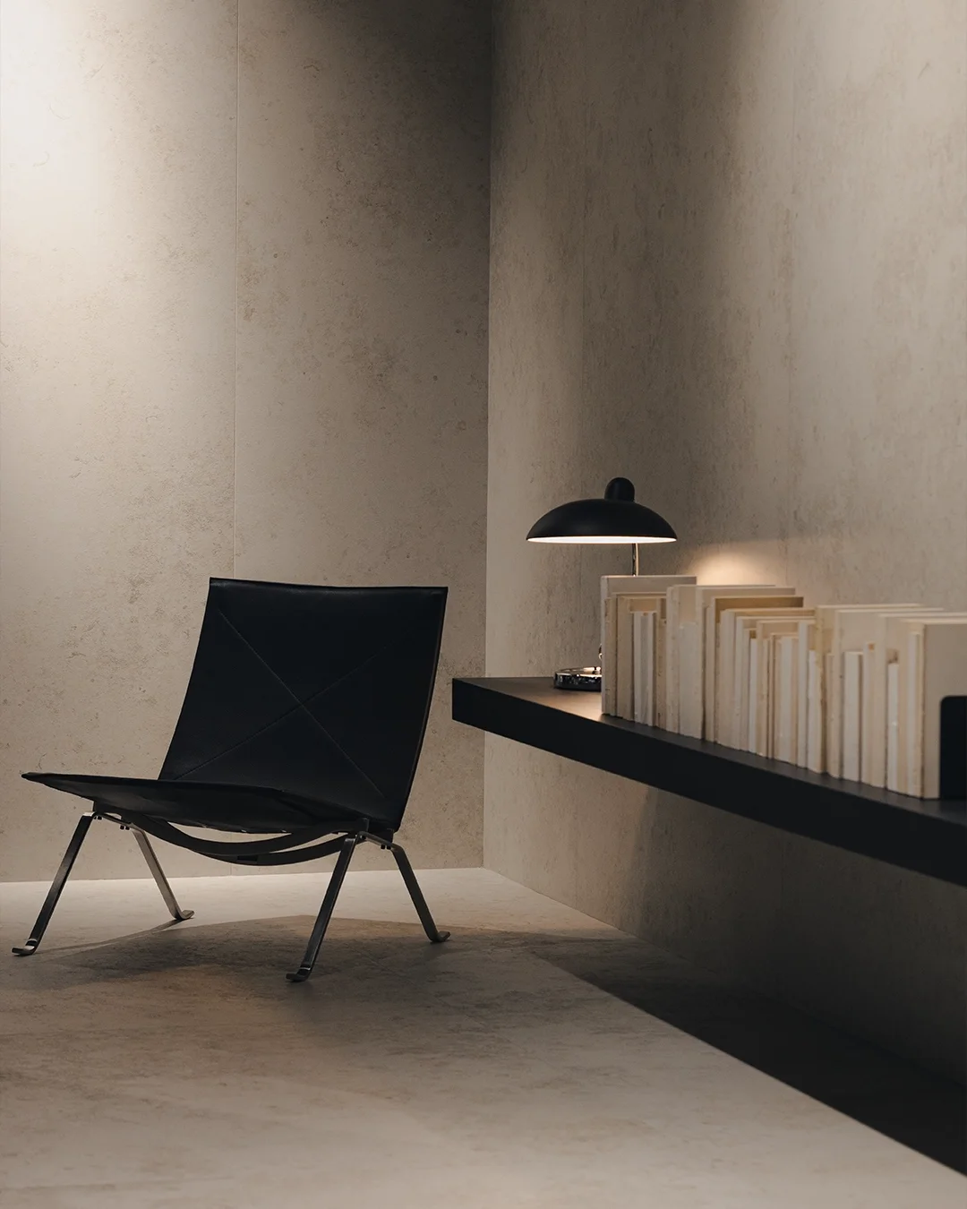 A minimalist study featuring the sleek Kendo collection in 'Ice' tone by Living Ceramics, covering both the flooring and floating walls, available through PietraCasa.
