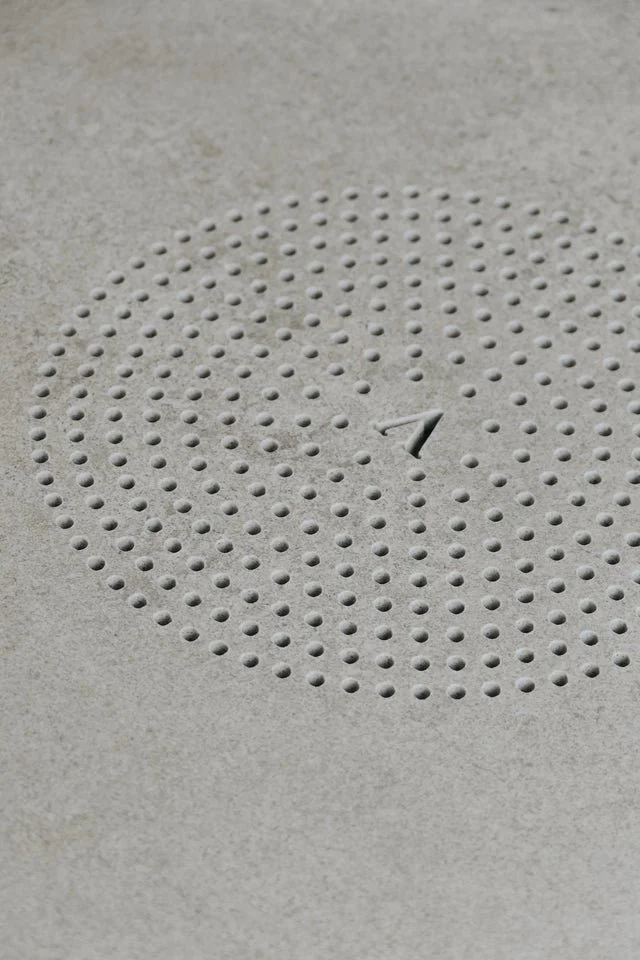 Clean precision-cut porcelain tile detailing from a custom PietraCasa fabrication project.