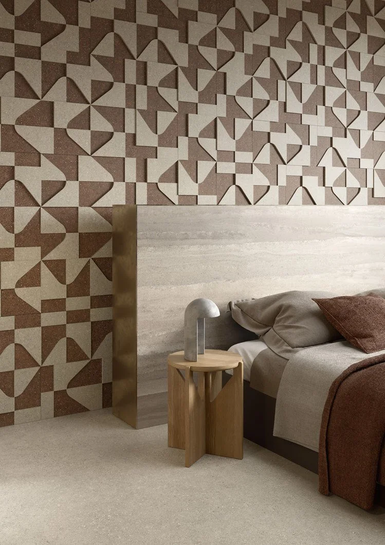 Modern bedroom interior featuring the Florim Compatta collection with walls finished in Pisé Sabbia, a warm, sandy-toned porcelain variant designed to evoke compacted soil, supplied and installed nationwide by PietraCasa.