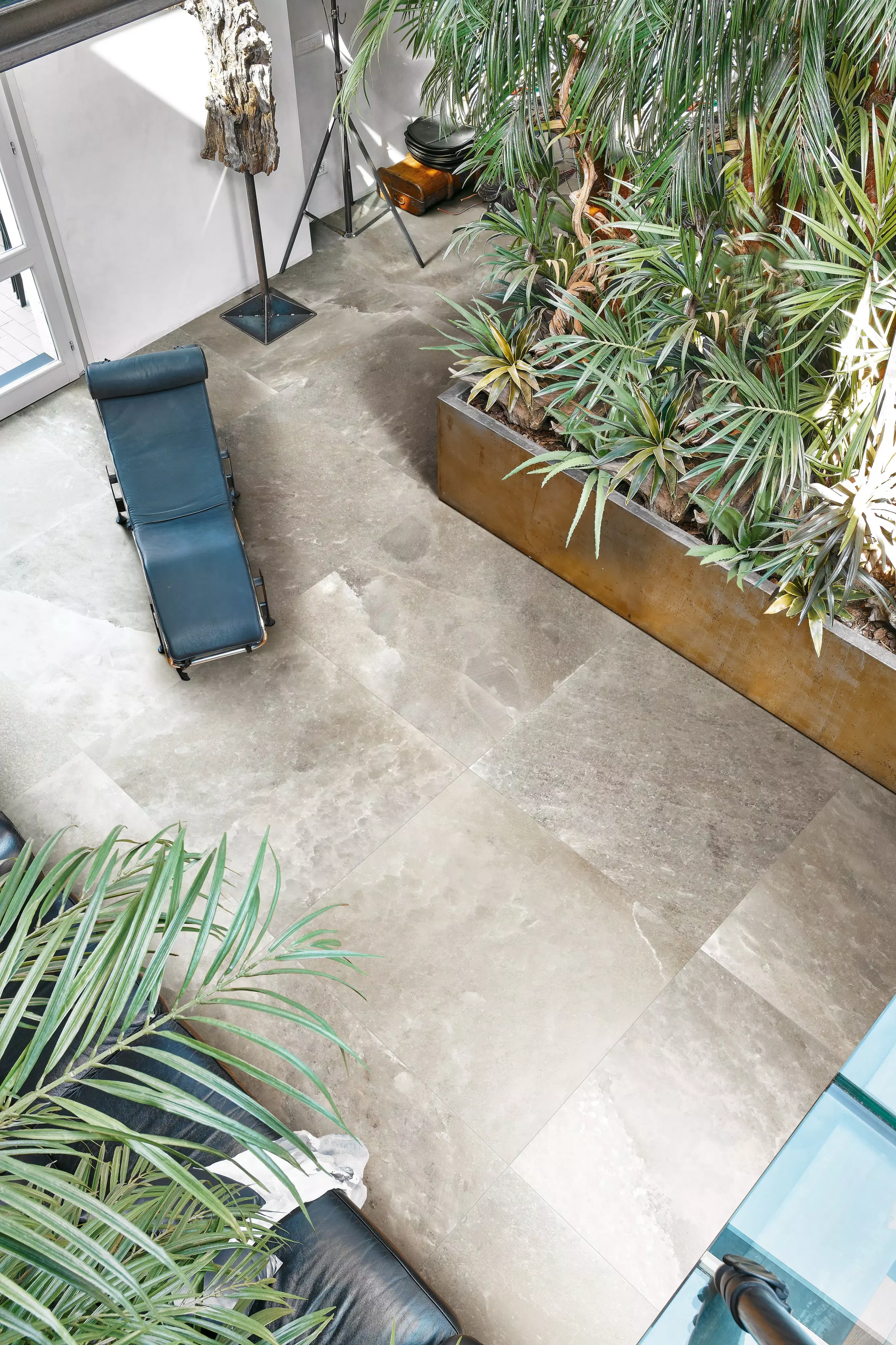 Sophisticated interior space featuring Florim Rock Salt porcelain flooring in the Danish Smoke color variation, expertly supplied and installed by PietraCasa.