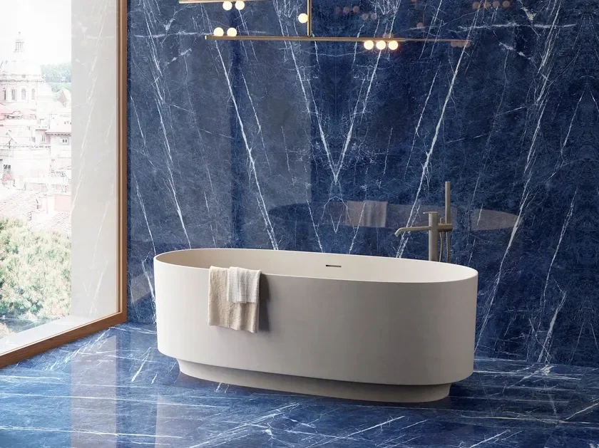 Modern bathroom interior featuring Fiandre Divine Blue porcelain slabs with a polished finish and luminous white veining, expertly supplied and installed by PietraCasa.