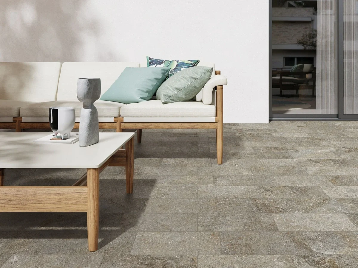 Outdoor patio space featuring the Supergres Adige stone-effect porcelain stoneware collection, designed for durable, non-slip indoor and outdoor applications, supplied by PietraCasa.