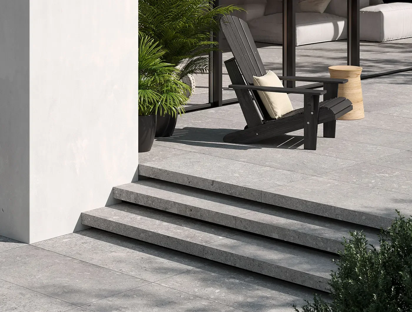 Outdoor steps and patio featuring the Vicentina Cenere porcelain tile by Terratinta Ceramiche, an Italian-made, 20mm thick outdoor tile that replicates natural Pietra di Vicenza stone in a gray color, supplied by PietraCasa.