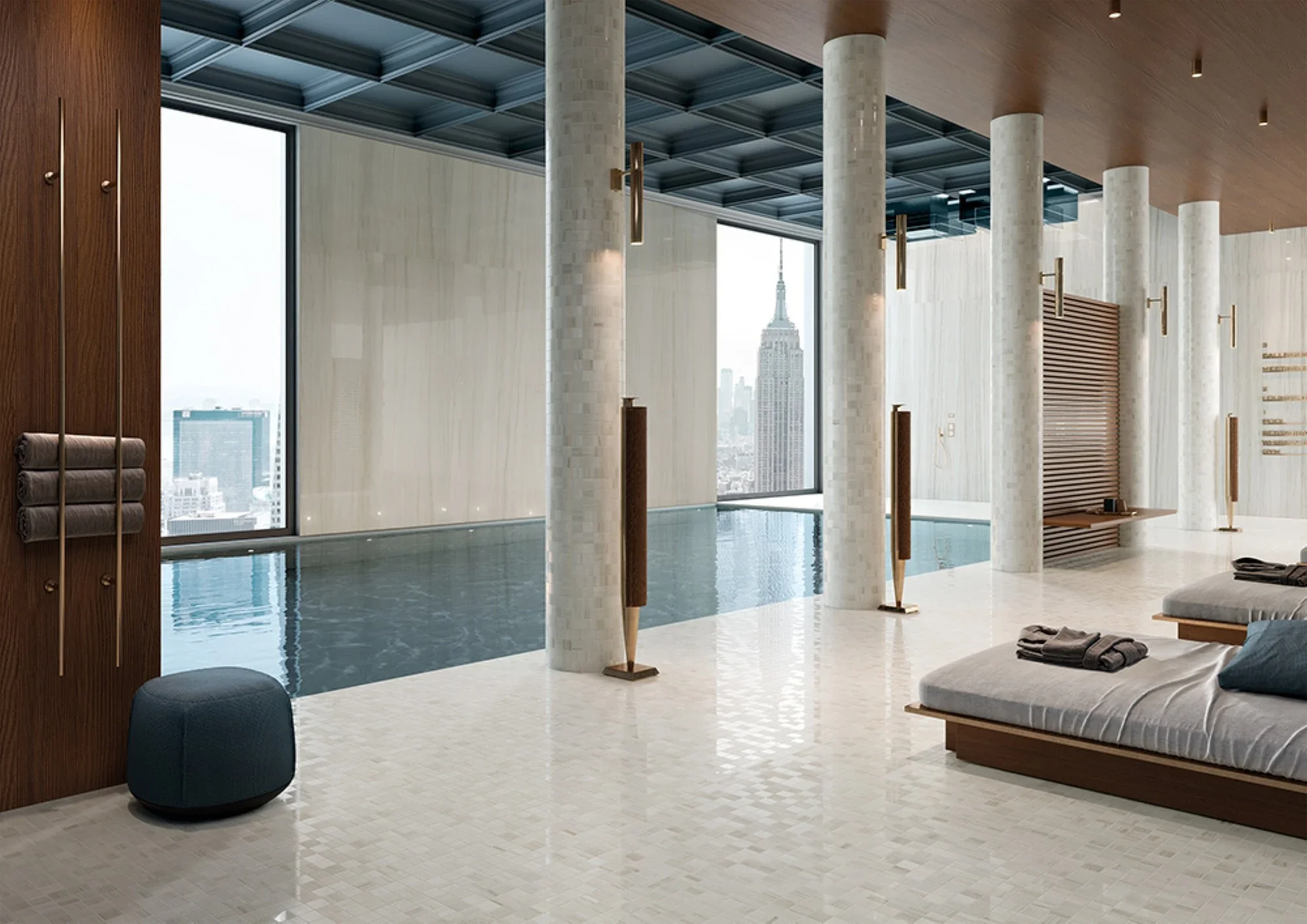 Luxurious high-rise pool area featuring premium Italgraniti Lux Experience porcelain stoneware in Calacatta Mont Blanc and Helsinki White marble effects, with mosaic floor tiles and large-format wall slabs, available through PietraCasa.