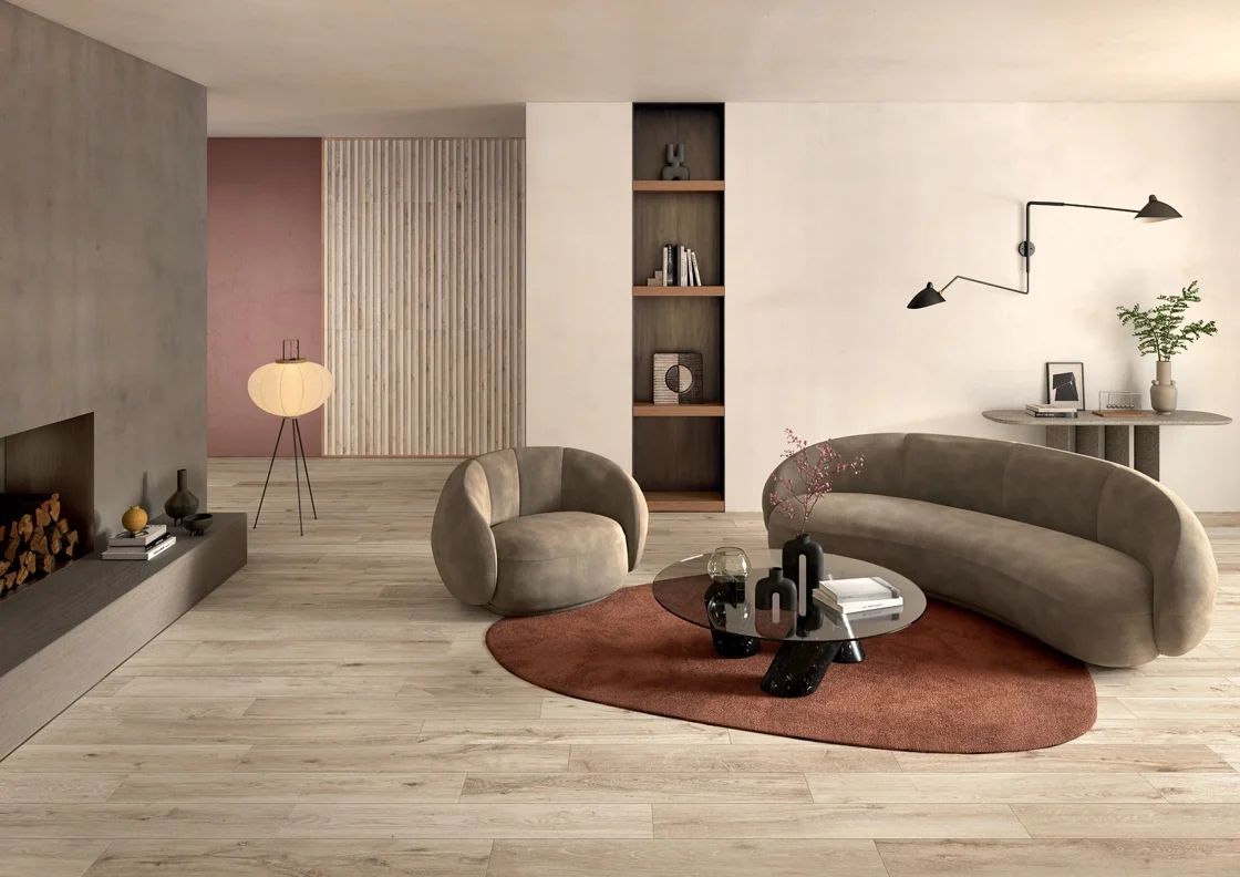 A modern lounge featuring the award-winning Pigmenti collection by Lea Ceramiche, a highly tactile, solid-color ultra-thin ceramic series designed by Ferruccio Laviani, available through PietraCasa.