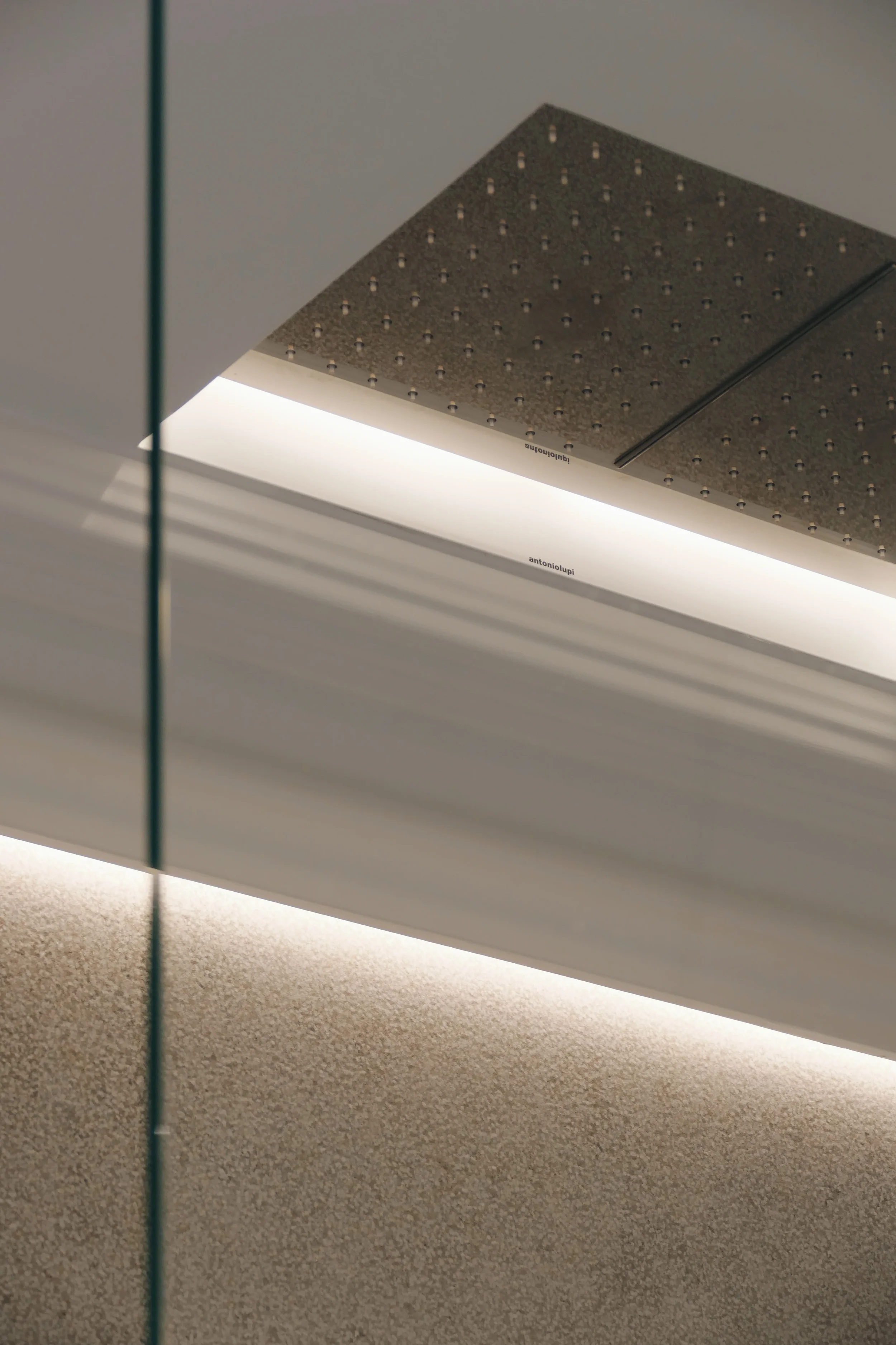 Antonio Lupi flush-fit ceiling shower head with recessed LED lighting