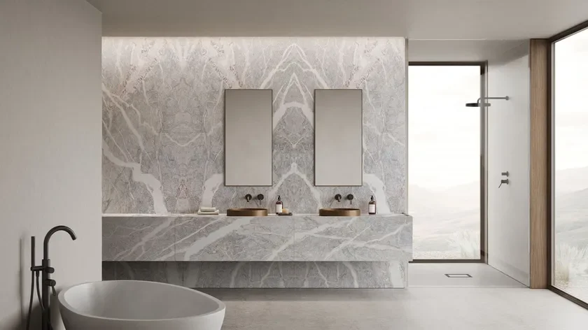Minimalist luxury bathroom featuring Fior di Pesco Carnico marble by Margraf, a unique Italian stone with intricate grey, white, and pink veining, supplied by PietraCasa.