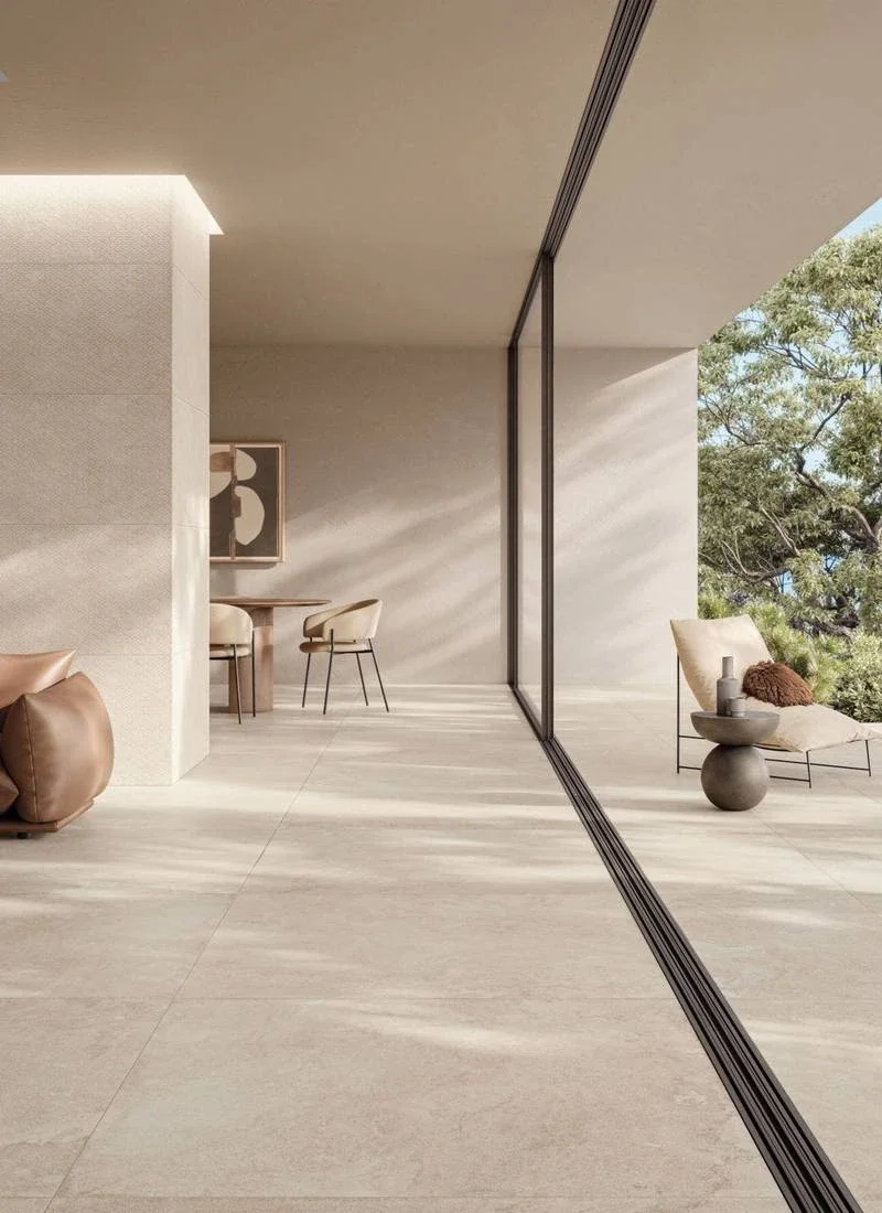 Sophisticated interior space featuring the Supergres Whisper collection of limestone-effect porcelain tiles in the color Dune, supplied by PietraCasa.