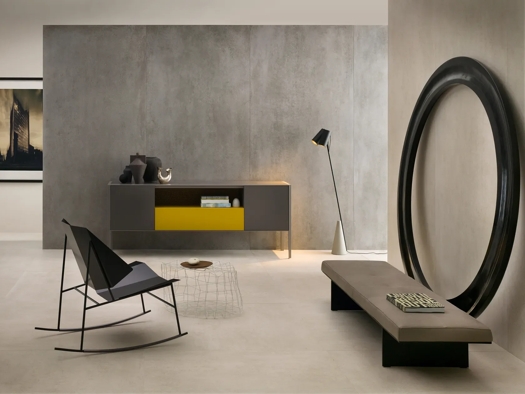 A modern space featuring Lea Ceramiche Concreto porcelain slabs, designed by Fabio Novembre, characterized by an industrial-chic cement aesthetic, available through PietraCasa.