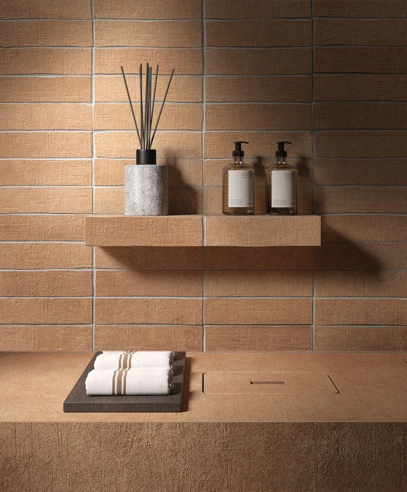 A modern minimalist bathroom showcasing bespoke porcelain stoneware elements from Kronos Ceramiche, available through PietraCasa.