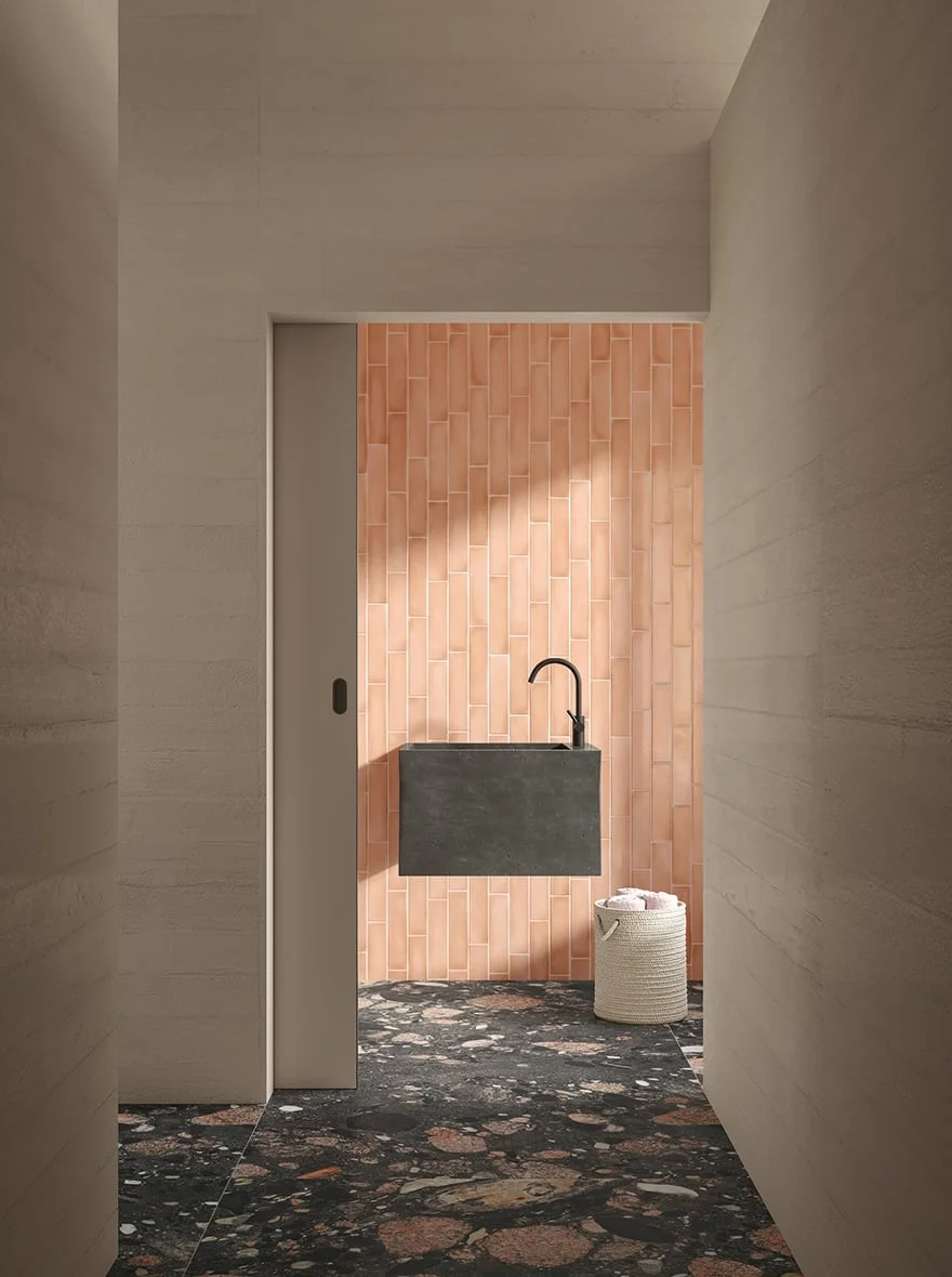 Contemporary bathroom space featuring the Thékē collection by Iris Ceramica, showcasing textured wall tiling and premium porcelain surfaces, available through PietraCasa.