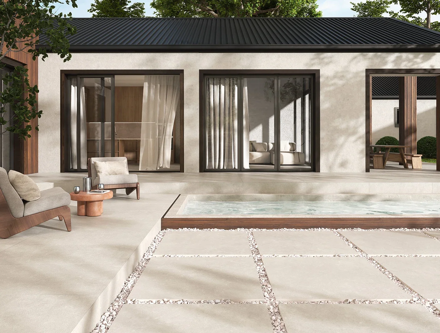 Outdoor patio and poolside space featuring the Less Beige collection by Terratinta Ceramiche, known for its natural limestone-inspired texture, creating a warm, minimalist aesthetic, supplied by PietraCasa.