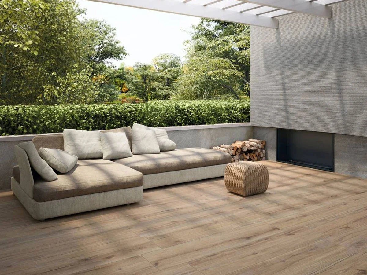 Outdoor terrace featuring wood-look porcelain stoneware flooring from the Supergres Ekho collection, offering the natural warmth of timber with the durability of porcelain, supplied by PietraCasa.