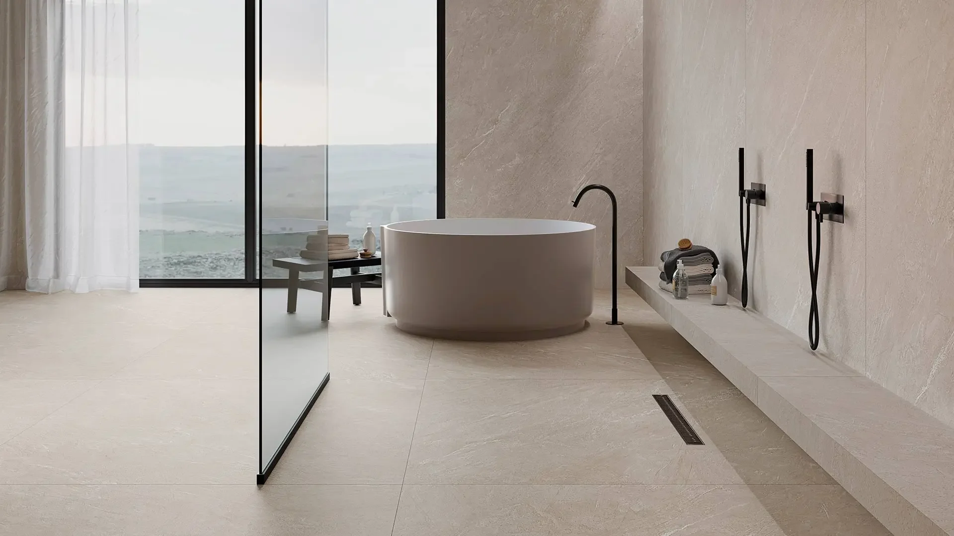 Tranquil bathroom suite featuring the Inalco Pacific collection, showcasing MDi large-format porcelain surfaces inspired by sea-worn stone, exclusively distributed in the UK by PietraCasa.