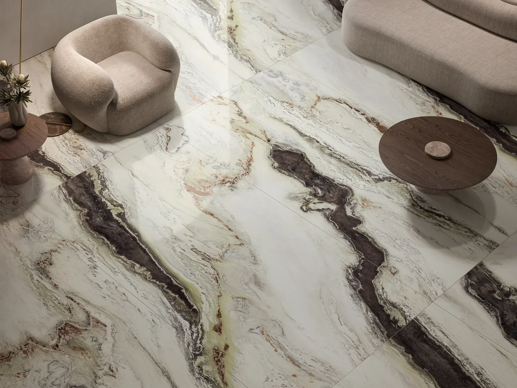 Luxurious flooring featuring Panda White large-format porcelain slabs by FMG Fabbrica Marmi e Graniti, perfectly mimicking natural Panda marble with dramatic black veining on a crisp white background, expertly supplied and installed by PietraCasa.