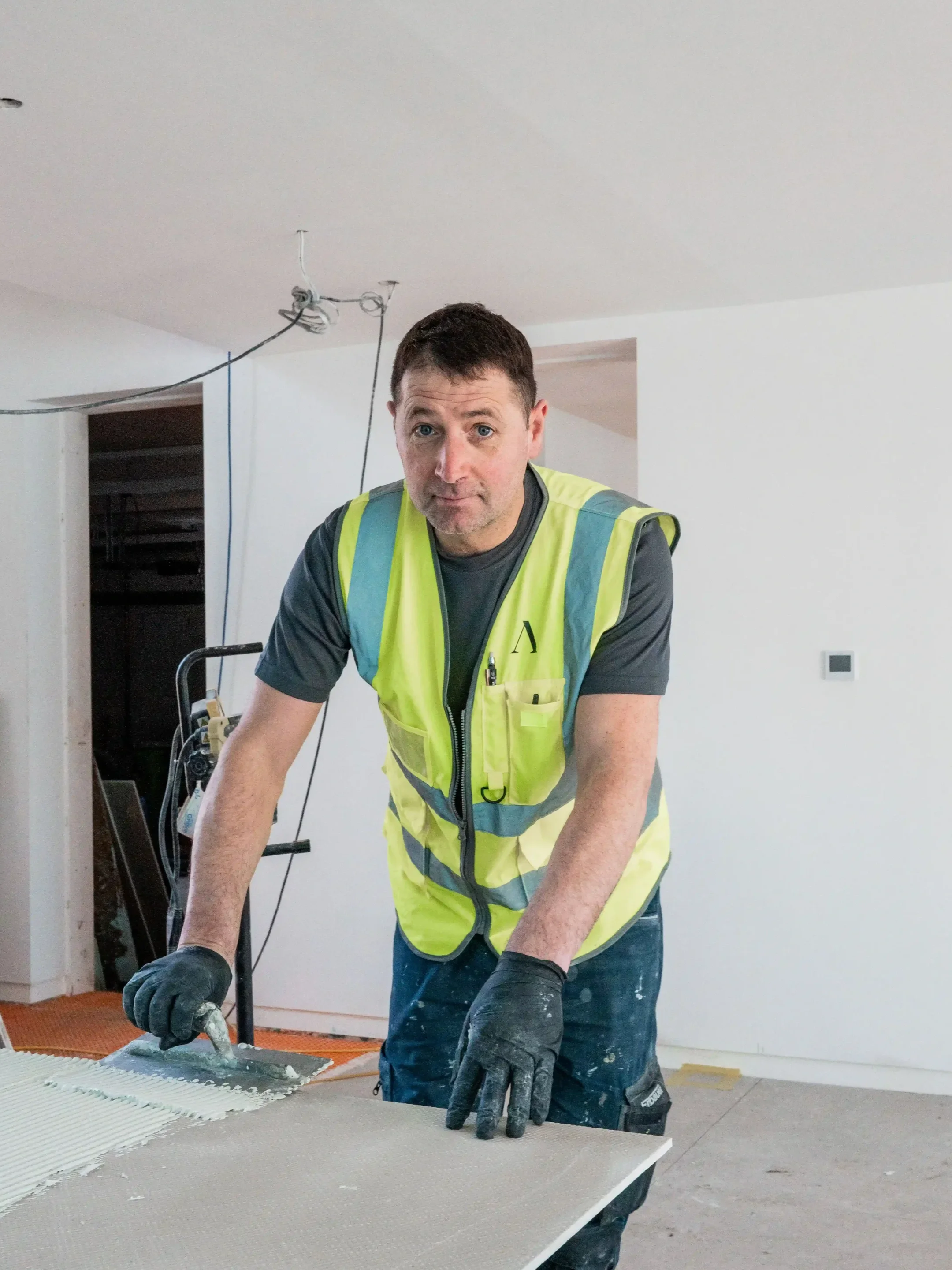 Tiling Specialist Irek Fatyga at PietraCasa, specializing in high-precision luxury porcelain installation and technical tile layouts.