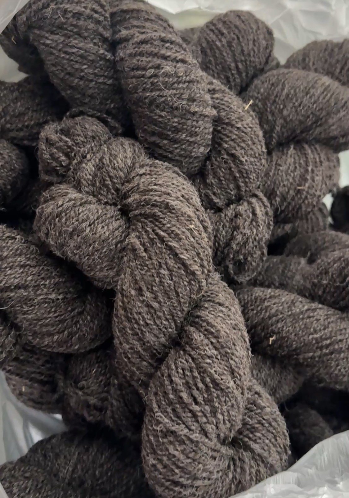 Close-up of brown, twisted, textured rope bundles, likely made of natural fibers.