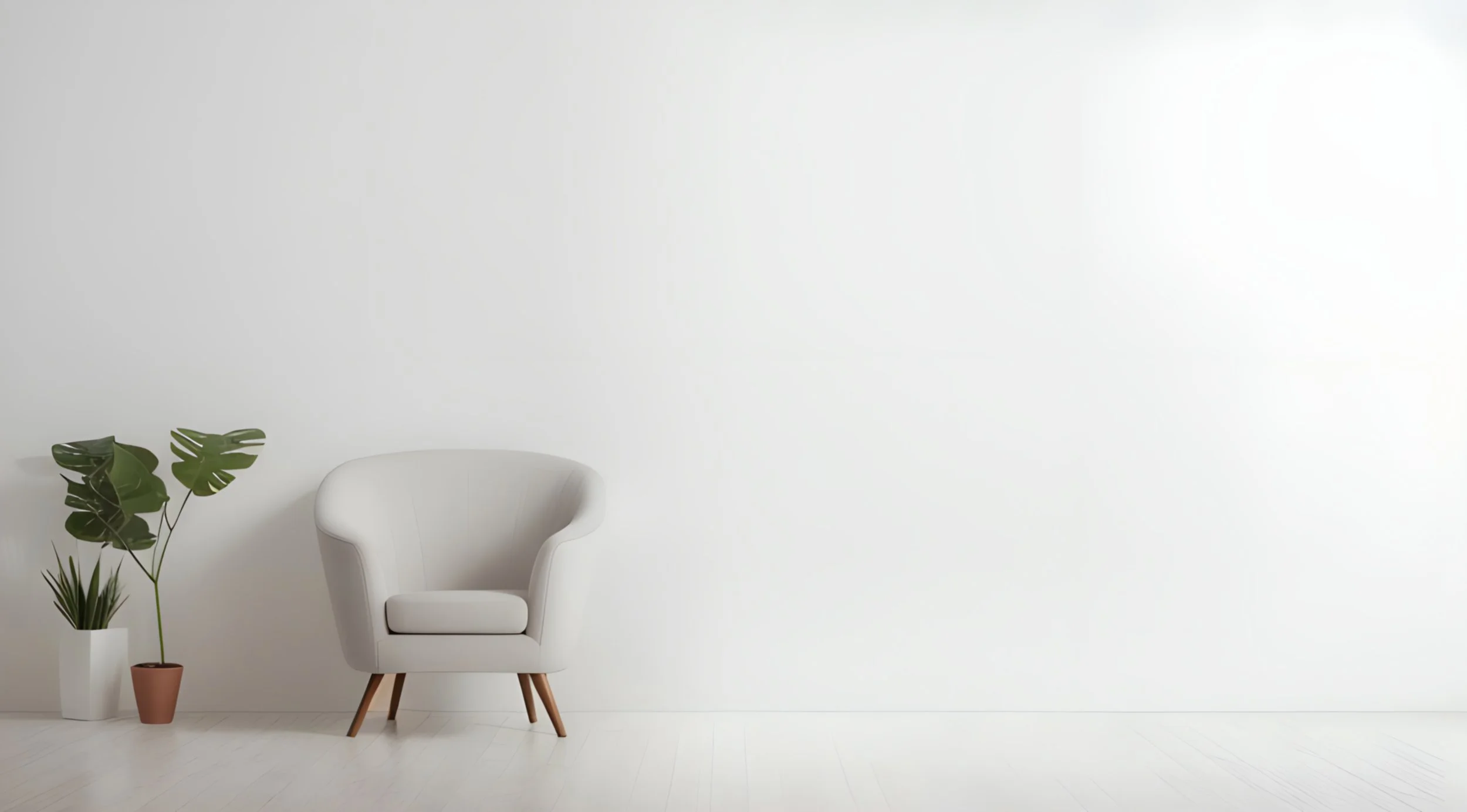 Minimalist interior with a white armchair, two potted plants with large green leaves, and a blank white wall.