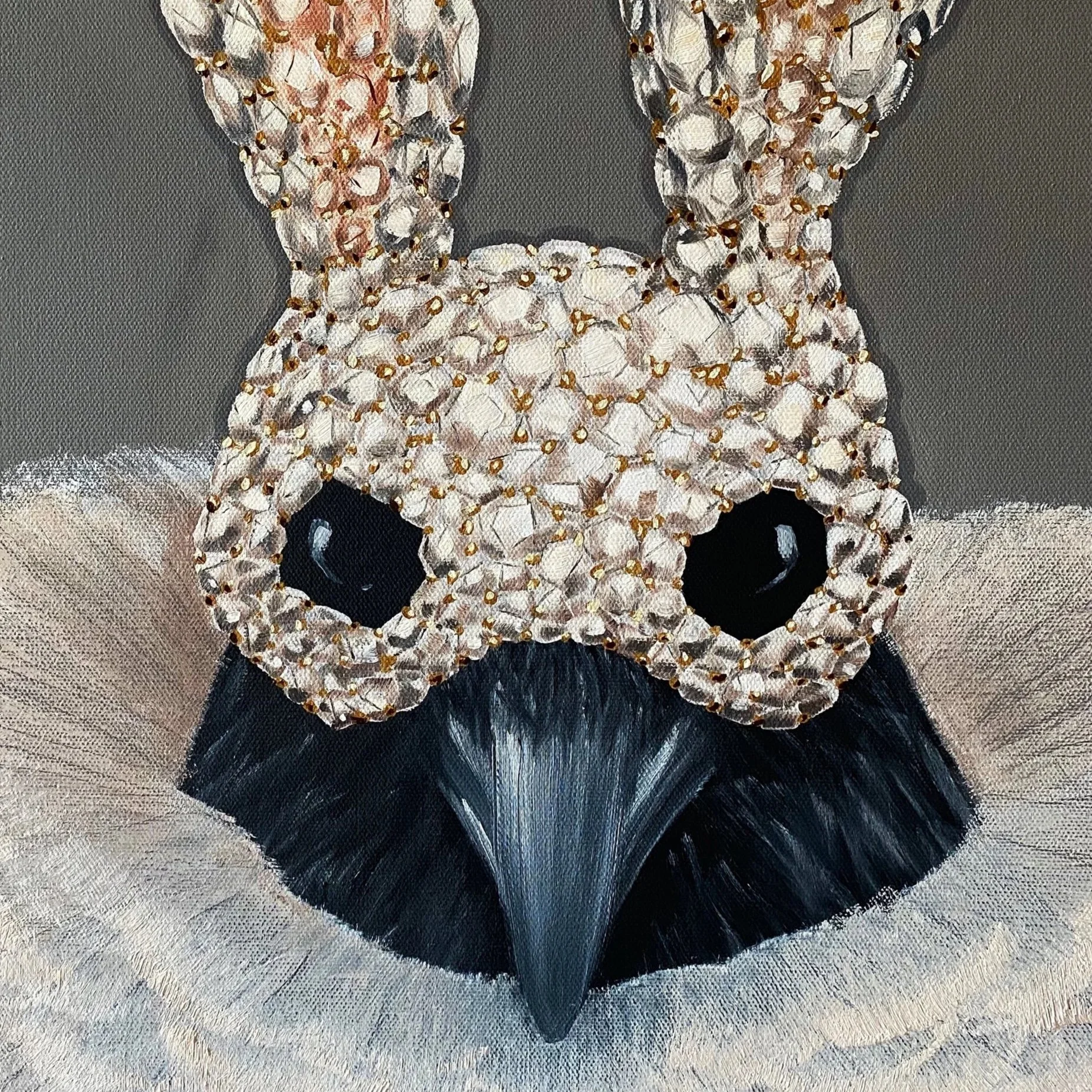 Close up image of the oil paintingDrowning in Tulle, that shows a black crow wearing a diamond encrusted bunny mask.
