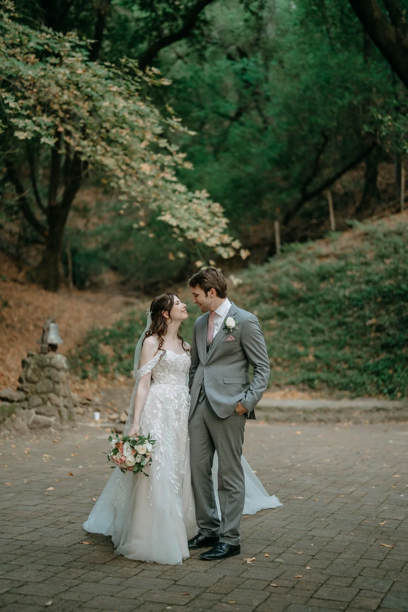 Bride and groom portrait on a garden path