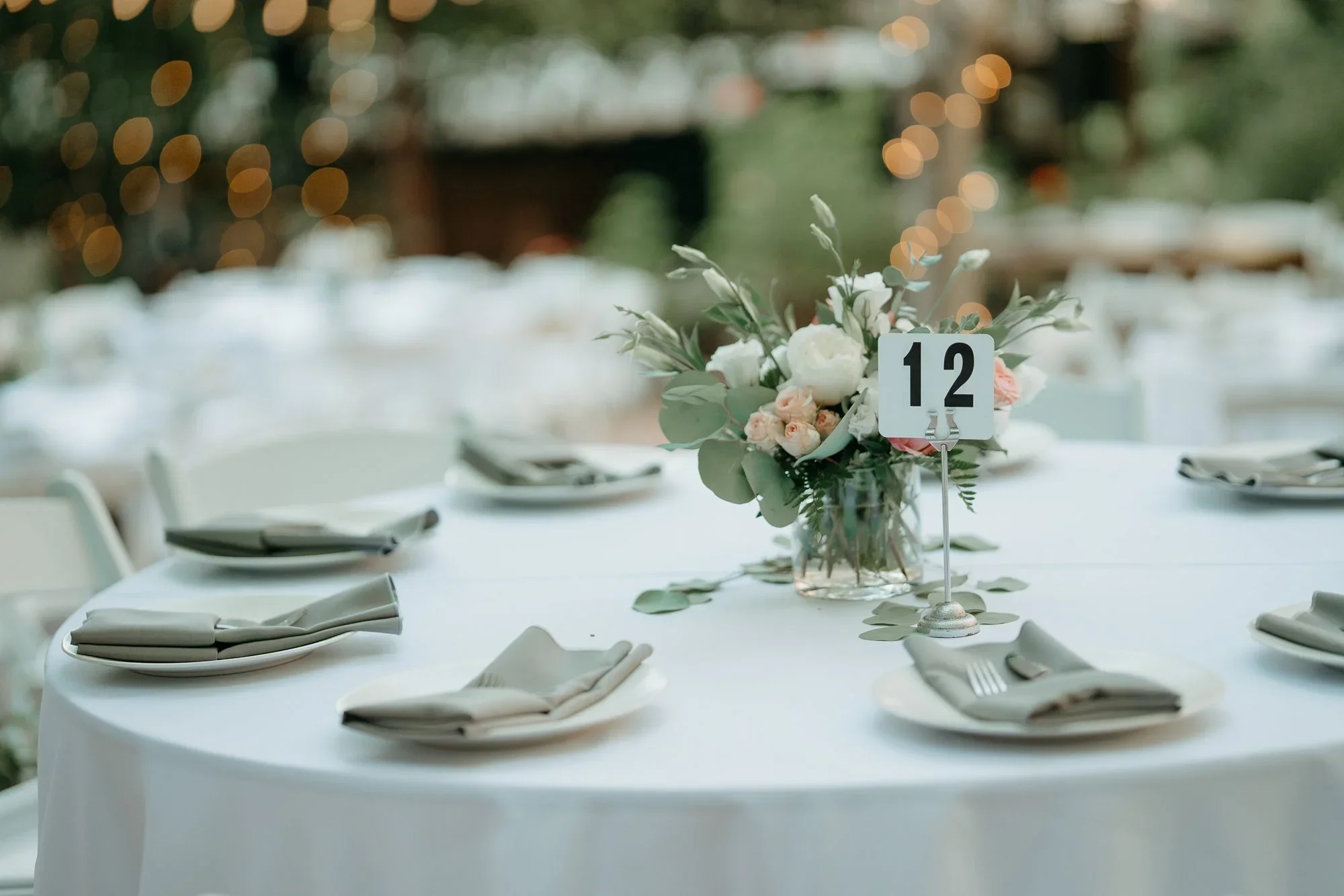 Reception table set with flowers and place settings