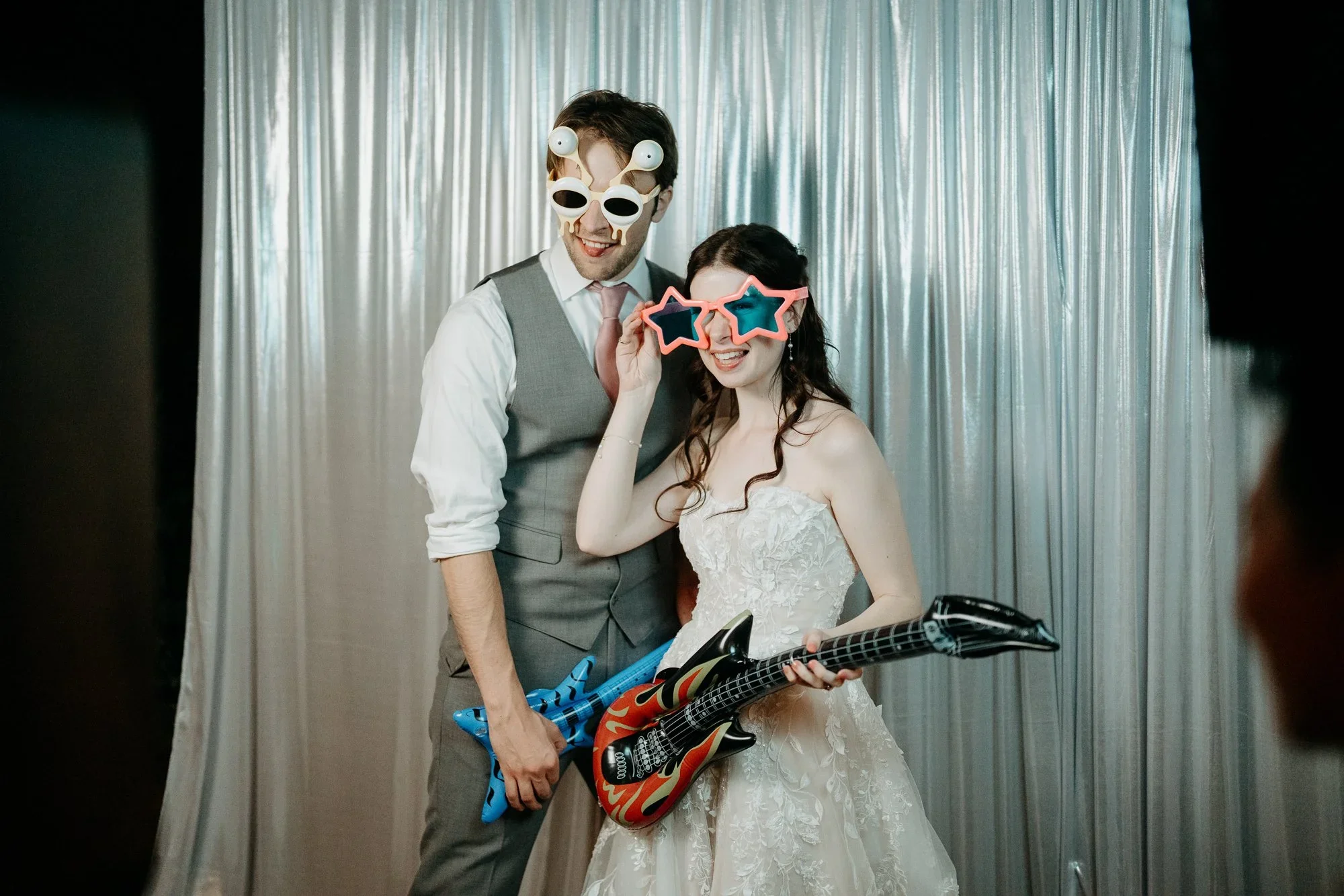 Couple having fun at the photo booth