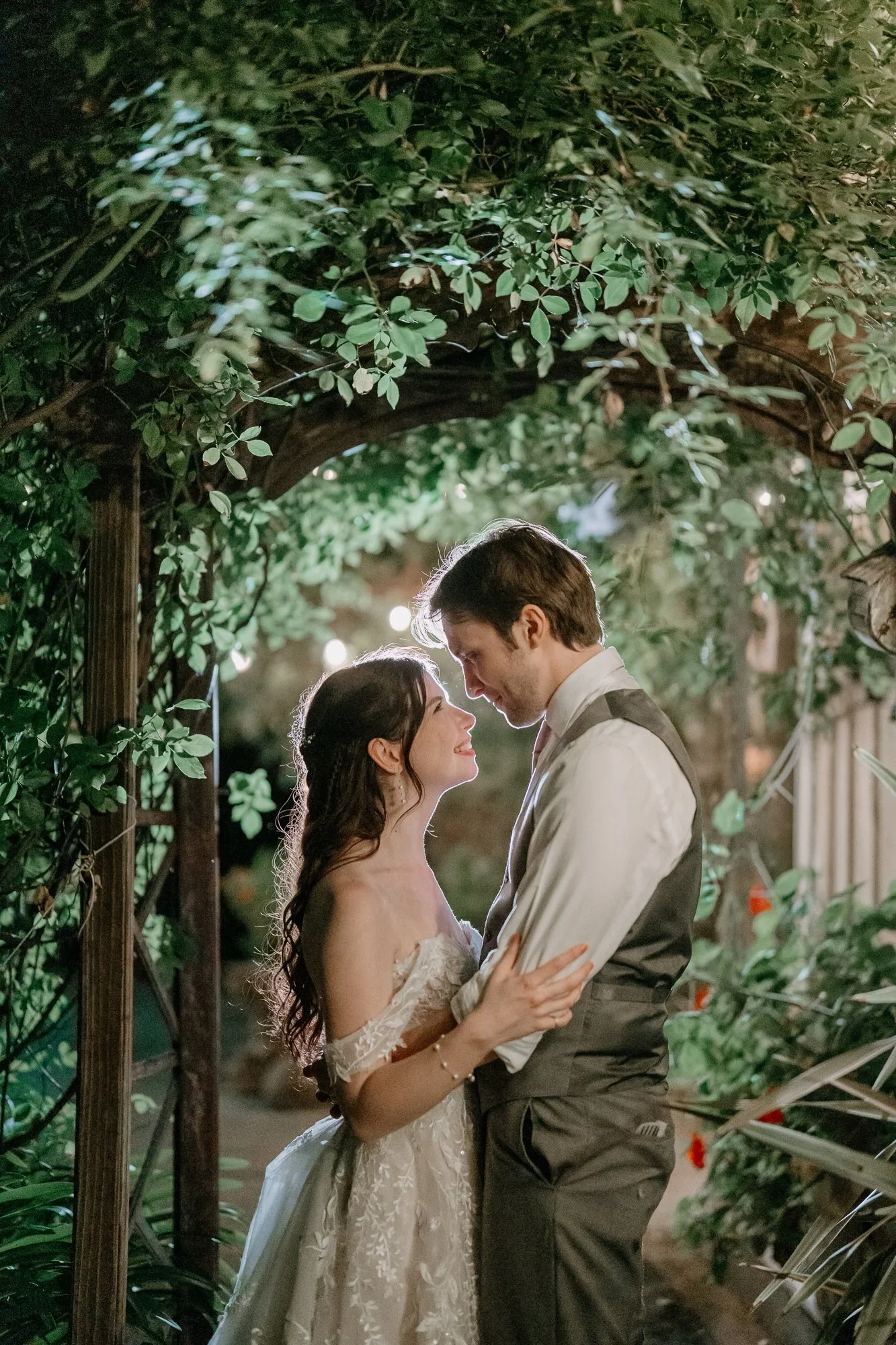 Couple sharing a quiet moment beneath the ivy