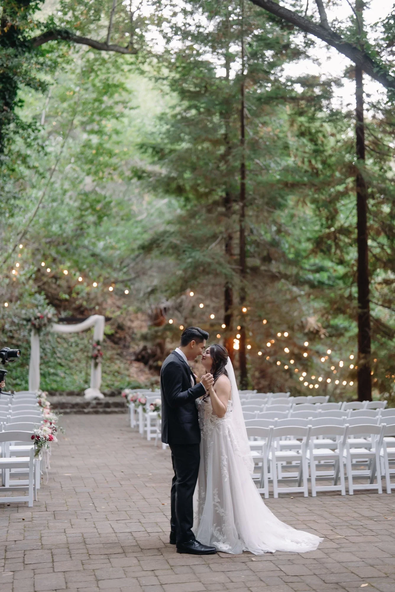 Couple at the altar during an outdoor ceremony