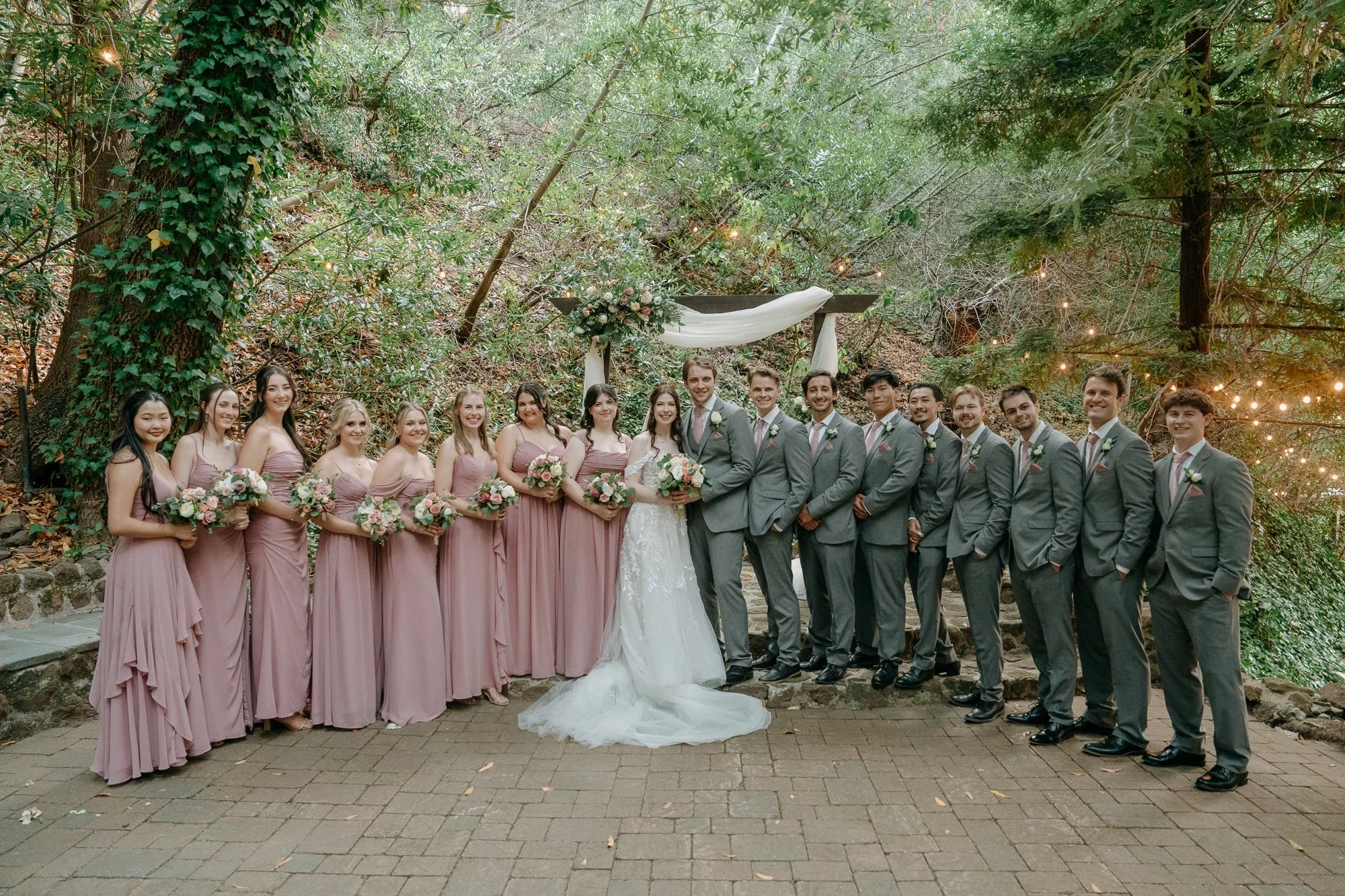Wedding party lined up in the garden