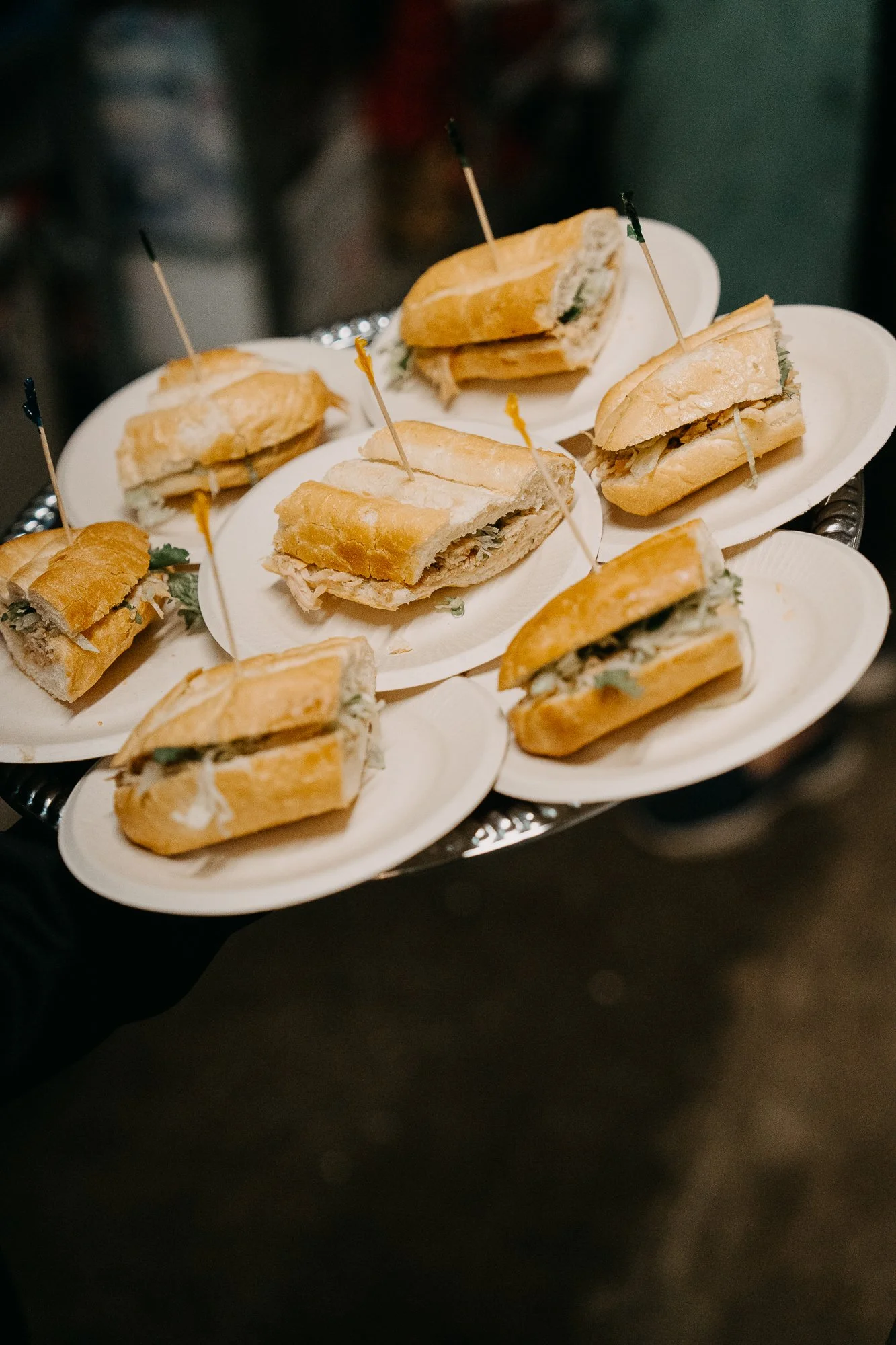 Mini sandwiches on serving plates from Lien's kitchen at Wildwood Acres