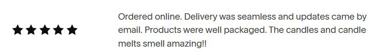 Customer review with five-star rating praising online order, seamless delivery, well-packaged products, and pleasant candle smells.