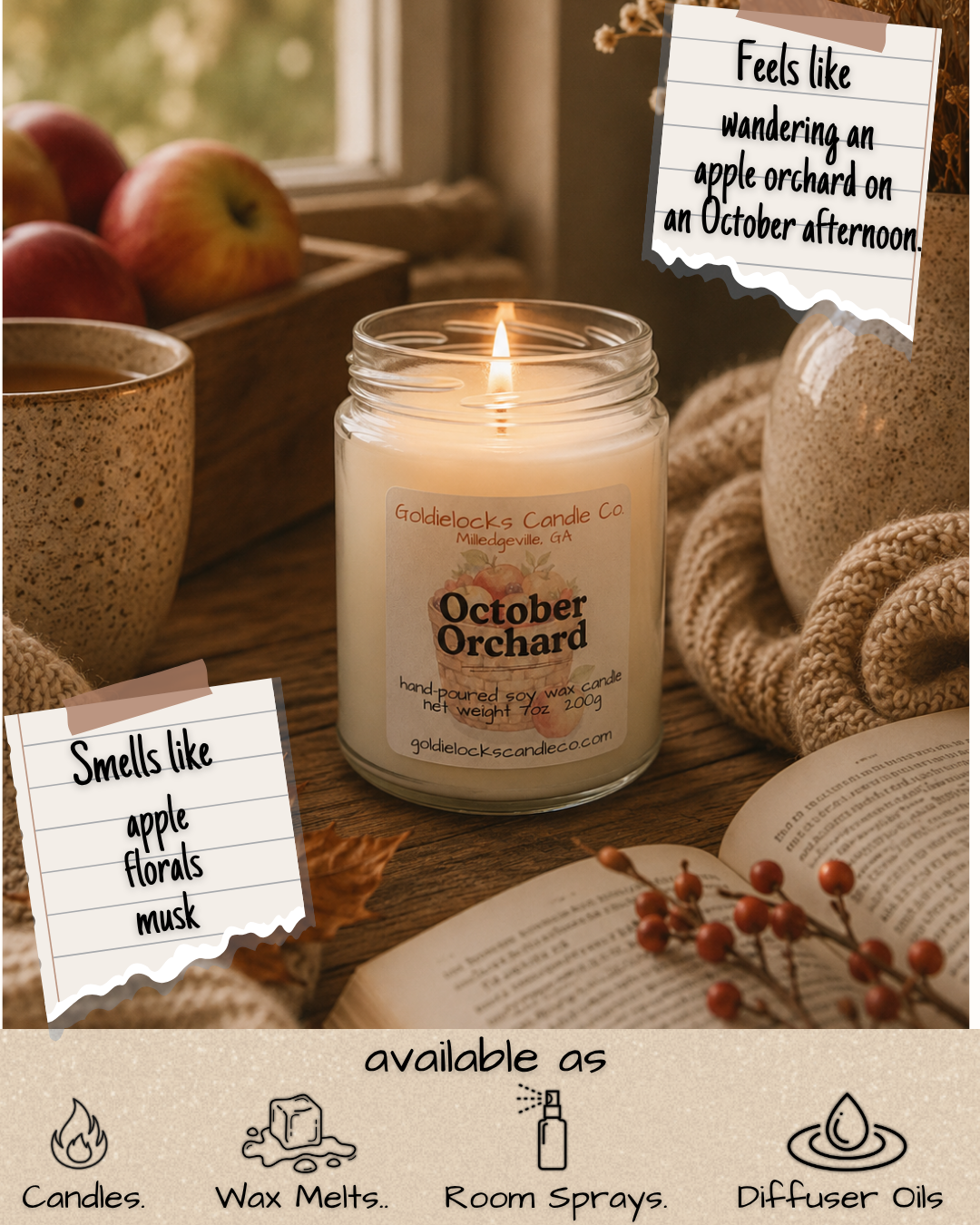 A cozy scene with a lit candle labeled 'October Orchard' from Goldielocks Candle Co., with apples, a mug, an open book, and notes that describe the scent as smelling like apple florals, musk, and wandering an apple orchard on an October afternoon, set near a window with autumn decor.