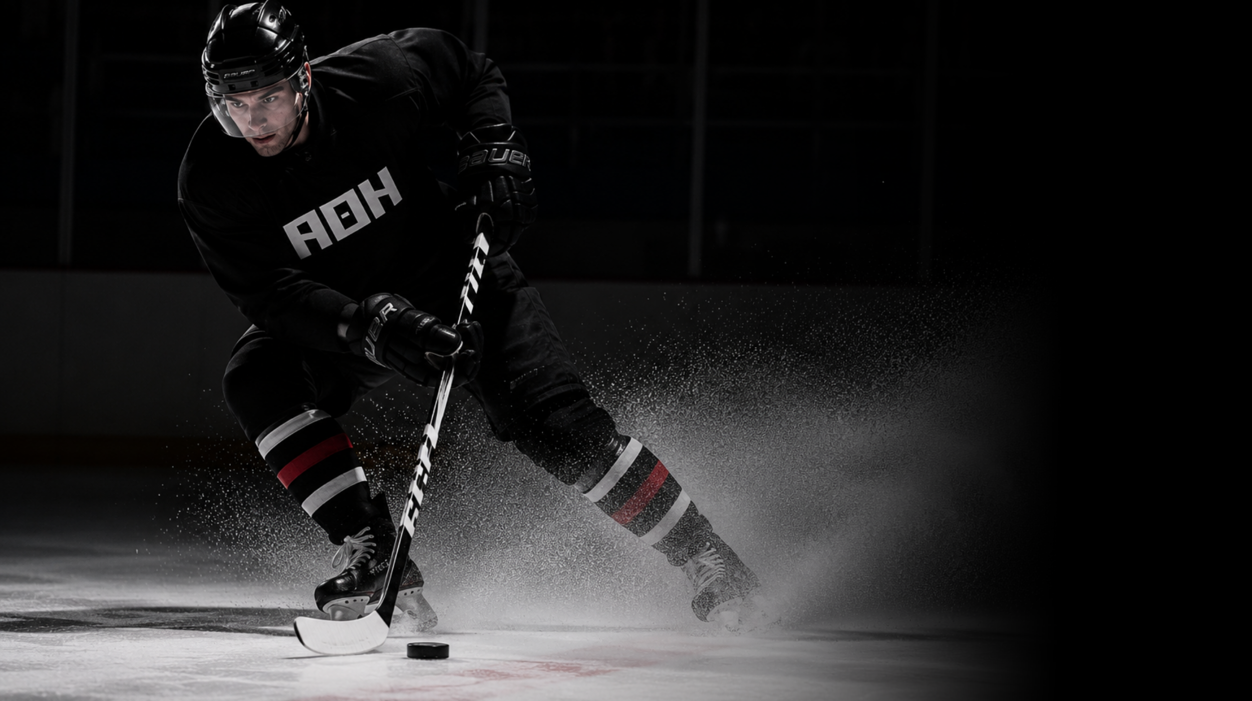 Hockey player practicing skating and puck control on the ice