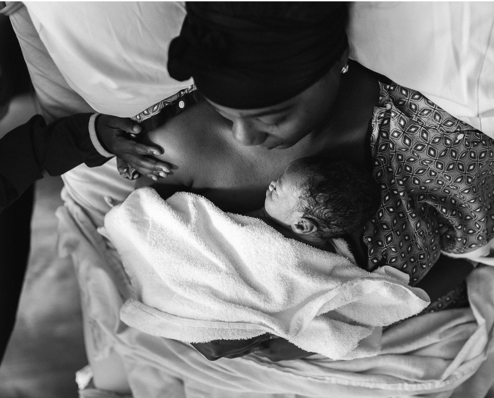 Nurse doula cradling a newborn