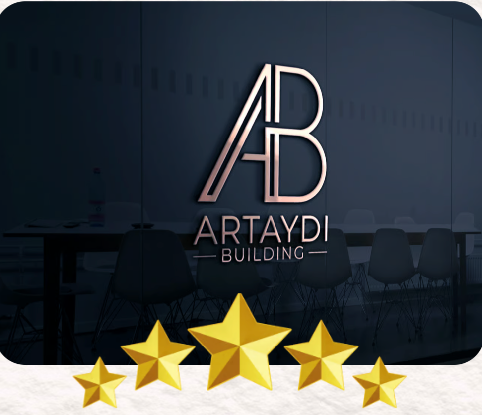 Sign reading 'ARTAYDI BUILDING' with a large stylized 'A' and 'B' logo above, in a modern office or conference room with chairs and a table, and five gold stars at the bottom.