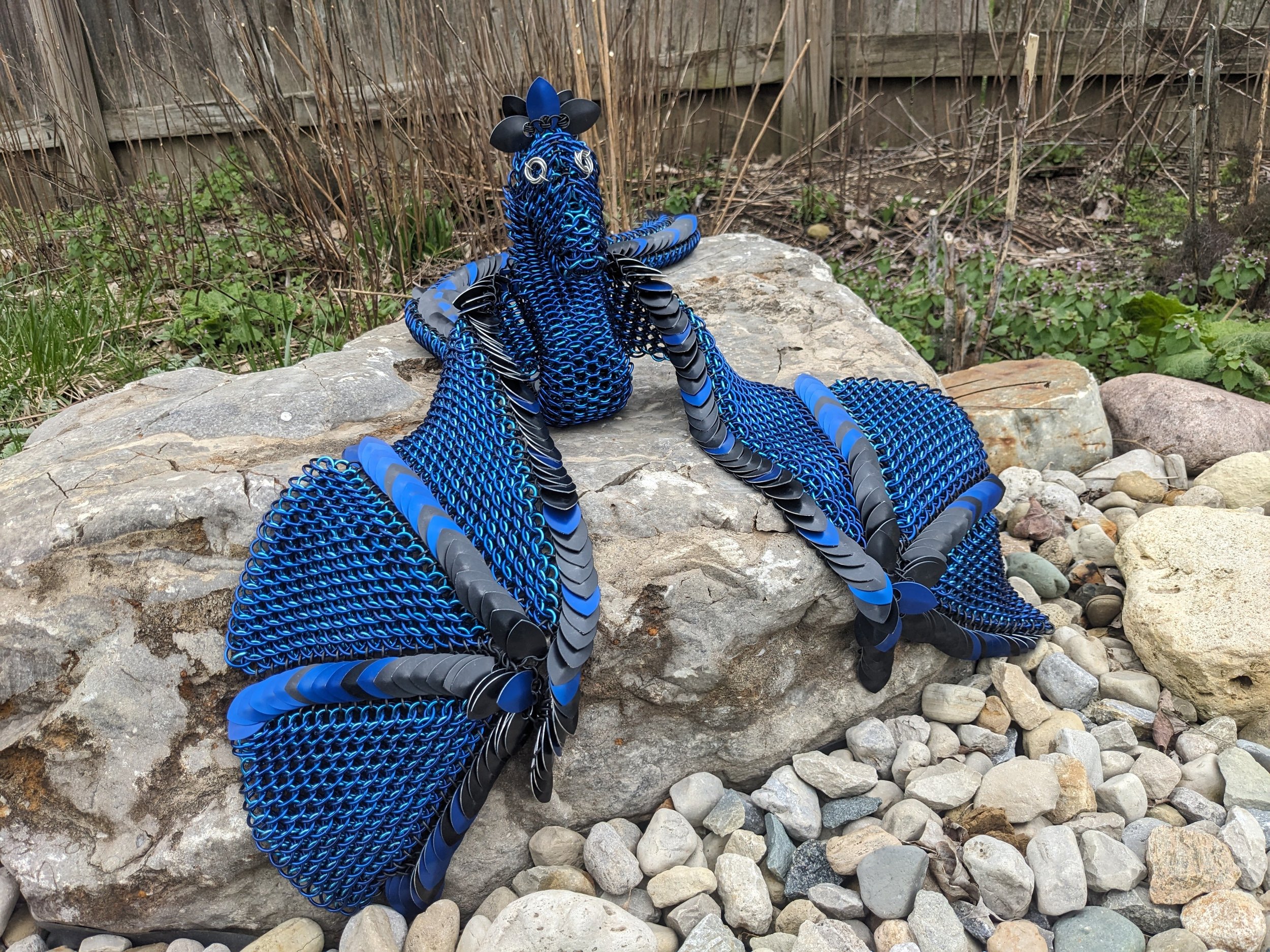 I made this chainmaille dragon in 2025. She is made out of 14swg gauge aluminum wire and can be worn as a belt. I followed a tutorial from Weaving Links for the base pattern and added a few of my own modifications.
